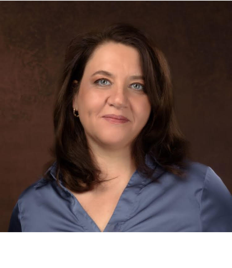 A profile picture of me with brown hair and light-colored eyes, wearing a dark blue shirt